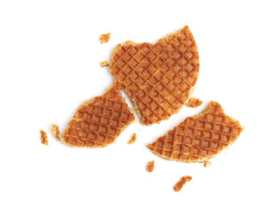Pieces of tasty waffle isolated on white, top view