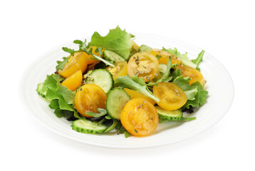Fresh salad with yellow tomatoes isolated on white