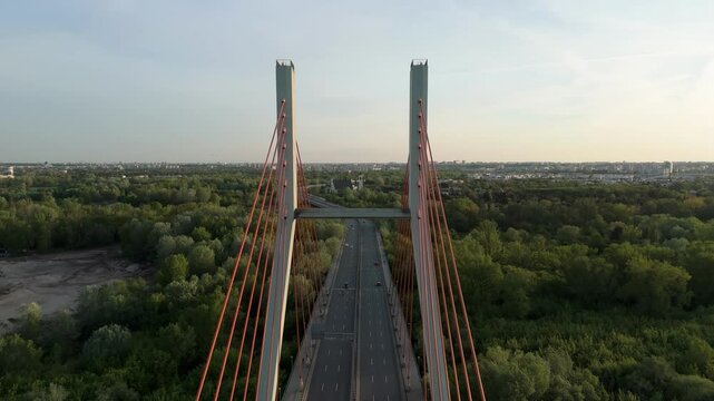 Siekierkowski bridge warsaw at sunset in spring, with cityscape in the distance, aerial view