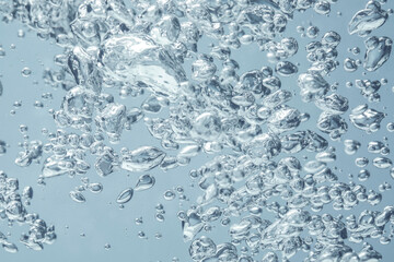 Soda water with bubbles as background, closeup