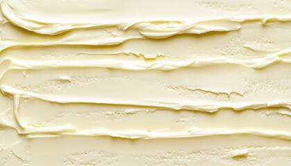 Creamy, pale yellow, swirled texture of a smooth, spreadable dessert