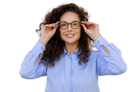 Professional businesswoman adjusting eyeglasses, confidently smiling against transparent backdrop