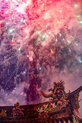 Obraz premium Night sky celebration, temple and fireworks dancing together