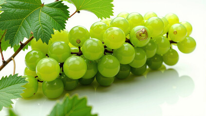 Obraz premium Bunch of Green Grape with leaves isolated on white background, Sweet Green Grape on a branch on white
