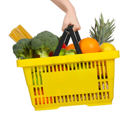 Woman holding shopping basket with different food products on white background, closeup
