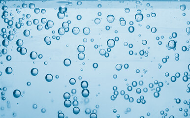 Soda water with bubbles as background, closeup
