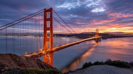 Obraz premium Golden Gate Bridge at Sunrise, vibrant colors, dramatic sky