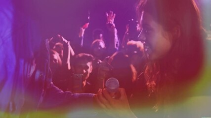 Female singer grabbing microphone on music stage, showing animated soundwave and smartphone metrics