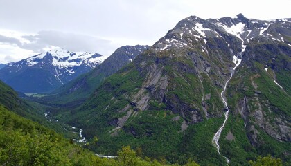 Naklejka premium Majestic Mountain Valley Landscape with Waterfall Scenic View