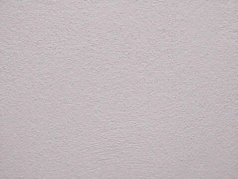 White paint wall texture or background with soft gotele, grainy, textured, scratched, rough and scratchy effect for typical Mediterranean house, chalet and villa interior and exterior in Spain.	