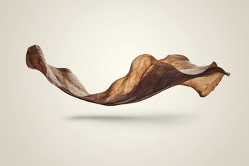 A dramatic, flowing, brown fabric draped in mid-air.