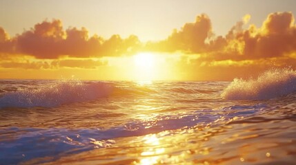 Obraz premium Scenic Sunrise Over Gentle Ocean Waves with Warm Colors and Soft Clouds Illuminated by Golden Sunlight