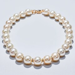 Fototapeta premium Elegant Cream Pearl Necklace with Gold Clasp on White Background