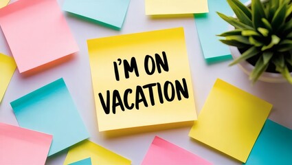 Vacation Note on Desk with Plant