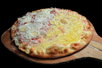 Brazilian pizza, half Portuguese and half mozzarella, coming out of the oven