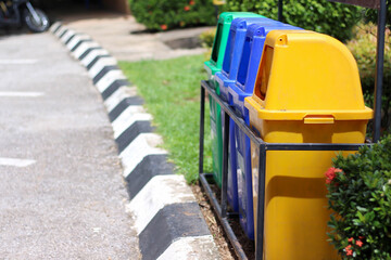 Big plastic bins on floor background in the side of street