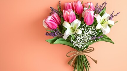 Obraz premium Artistic bouquet of vibrant pink tulips, white lilies, and lavender sprigs with babyâ€™s breath, tied with a twine bow, placed diagonally on a pastel coral background with ample negative space.