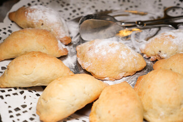 Freshly baked pastries served on a lace tablecloth