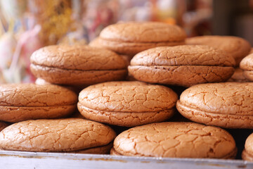 Freshly baked cookies stacked on display at a local bakery