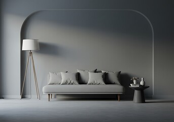 A minimalist living room featuring a gray sofa, lamp, and side table against a gray backdrop