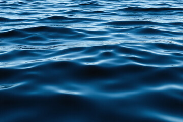 Naklejka premium dark blue ocean with ripples in the water
