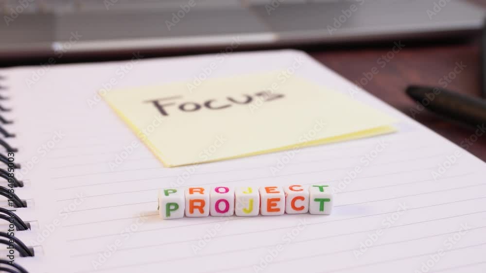 Poster a blurry image of a stack of colored blocks with the word 
