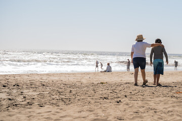 A Warm Beach Walk Embracing Togetherness while Enjoying the Beautiful Ocean View