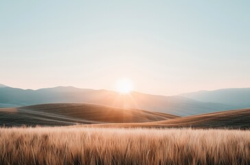 A serene landscape featuring rolling hills bathed in the warm glow of sunrise, with golden grasses swaying gently in the foreground.