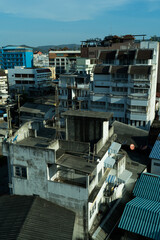 Fototapeta premium city view, the old architecture of reveals a tapestry of residential buildings and rooftops under a blue sky