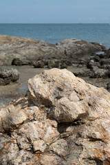 Rocky outcrops meet the blue sea along the Italian coastline