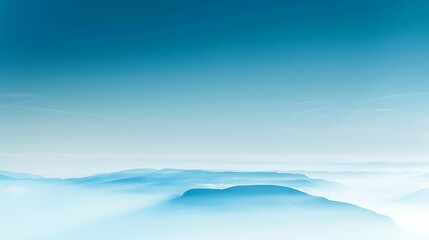 Serene horizons: layers of hazy mountain ranges beneath a pale blue sky