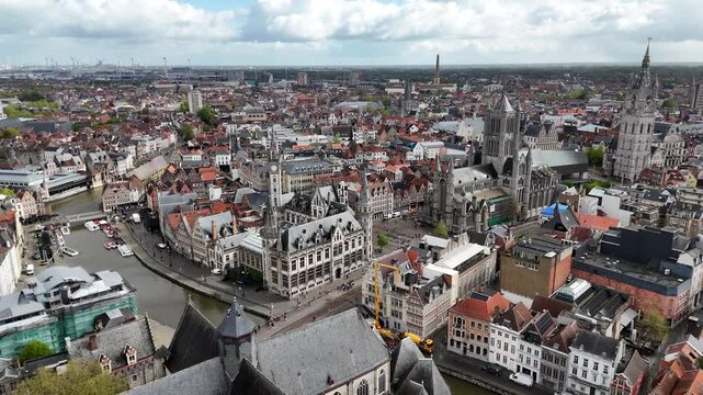 DJI_20Aerial skyline of Ghent old town, Belgium, with famous landmarks "three Towers" (Belfry of Ghent, St. Bavo's Cathedral, St. Nicholas' Church) standing out amid the historic bu240425170747_0017_D