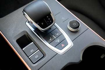 Automatic transmission selector in the interior of a modern car.
