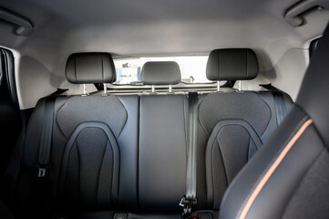 Close-up of black leather seat of modern car