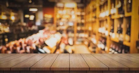 Empty wooden table top with lights bokeh on blur restaurant background.