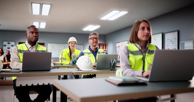 Students Work In A Classroom With Laptops
