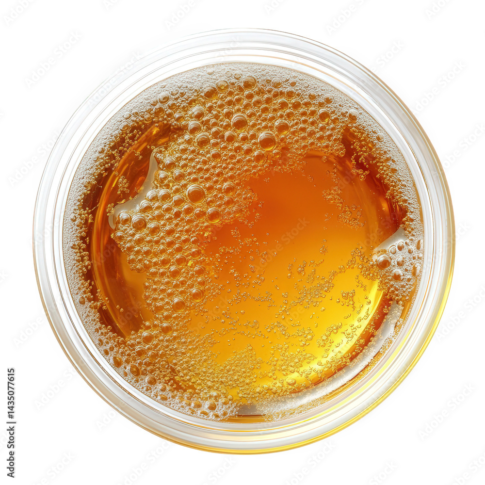 Poster close-up view of a frothy glass of beer. showcasing its golden color and effervescence the bubbles r