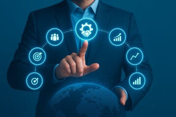 Businessman touching virtual icons of teamwork, goal, and growth on a digital globe interface.