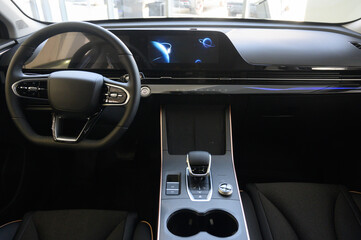 Car interior - steering wheel, shift lever and dashboard. Car modern inside.