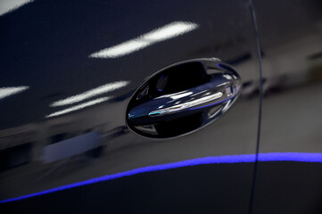 Obraz premium Modern door handle new car. Smart retractable door handles