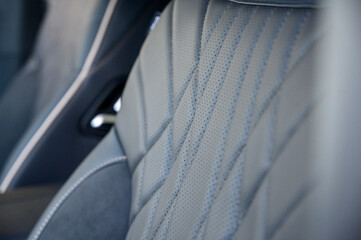Close-up of black leather seat of modern car