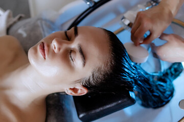 Japanese Head Spa Therapy: Relaxing Scalp Treatment at a Beauty Salon with massage brush, Focused on Scalp Care and Hair Wellness