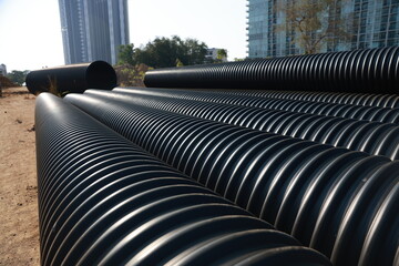 Black Sewer Drain Pipe Construction Equipment and Materials Backgrounds and Textures