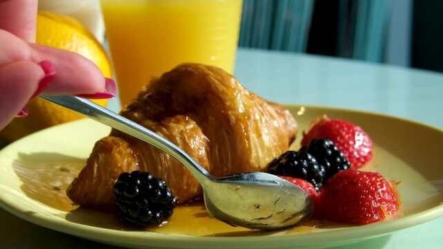 Croissant berries juice Breakfast table with croissants and fruits