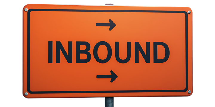 An orange sign displaying the word "INBOUND" with directional arrows indicating movement towards a location.