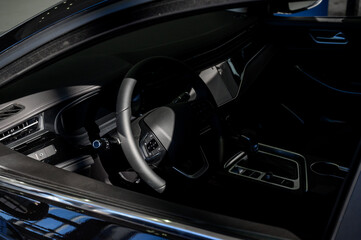 Car interior - steering wheel, shift lever and dashboard. Car modern inside.