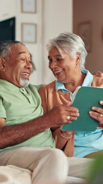 Senior, couple and laughing with tablet in home for funny puzzle game, watching comedy movie and bonding. Retirement, happy people and relax on sofa with digital app for streaming show or comic blog