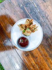 Crispy Pangsit Isi Baso Served with Tangy Sauce for a Delicious Experience