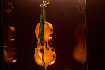 Violinmaking historical masterpieces on Display in Treasure box room in violin museum Cremona, Italy