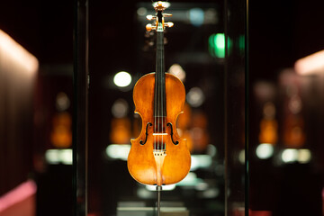 Violinmaking historical masterpieces on Display in Treasure box room in violin museum Cremona, Italy